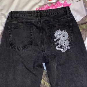 Black mom jeans with dragon graphic